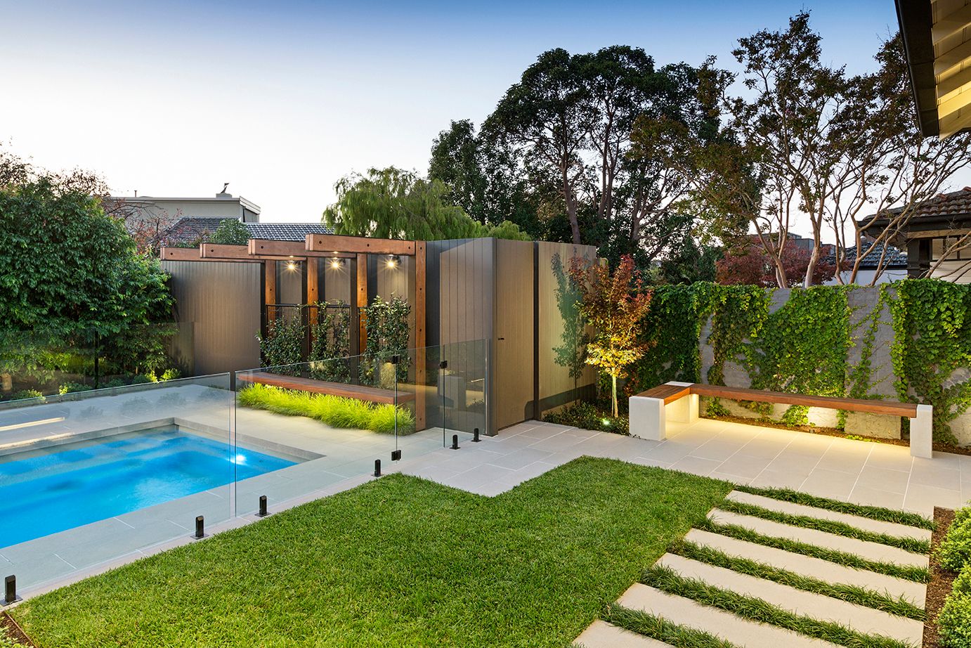 Custom bench design with an overhead arbour by the swimming pool in Melbourne.