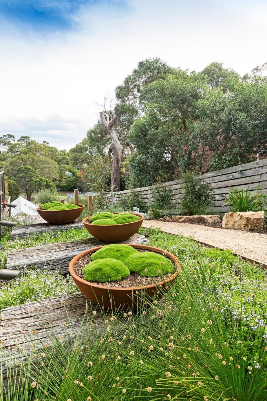 Feature garden bowls make a statement in this coastal landscape design.